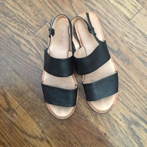 Black leather COS sandals.